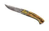 Couteau pliant d'exception en édition limitée avec lame damas manche en ivoire de mammouth et mitre avant avec engrenages en or et argent 