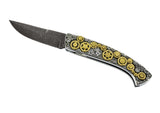 Couteau pliant d'exception en édition limitée avec lame damas vegas forge manche avant planque d'engrenages rotatifs or 18 carats et argent et manche arrière plaque d'engrenages fixes en argent