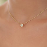Simplicité pendant, round, gold and diamond
