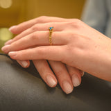 Ring French Kiss in gold and blue topaz 5 mm