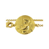 13 cm gold curb chain, angel with pipe Tournaire